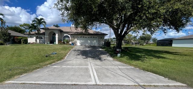 Driveway before pressure washing