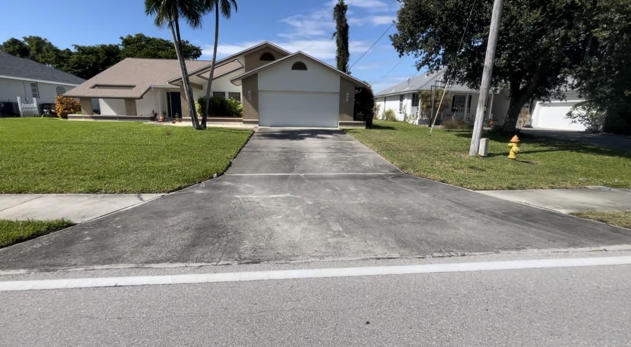 Driveway before pressure washing